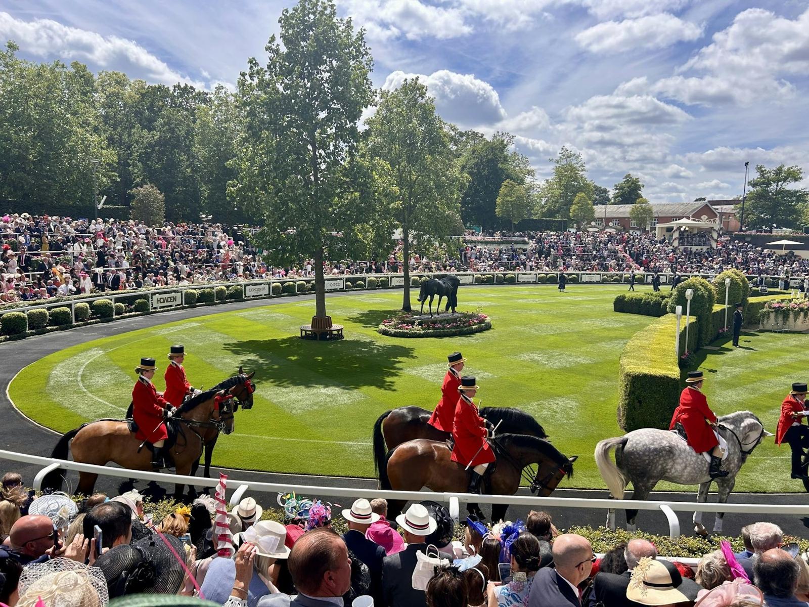 Horses and riders at Ascot racecourse in the United Kingdom; illustrative stock photograph